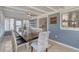 Bright dining area featuring a ceiling fan, tile flooring, and lots of natural light at 832 E 4Th St, Englewood, FL 34223
