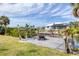 Outdoor dock overlooking the canal, with a built-in fire pit, perfect for relaxing and enjoying water views at 832 E 4Th St, Englewood, FL 34223