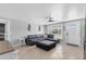 Inviting living room featuring tile floors, a ceiling fan, and a comfortable gray sectional sofa at 832 E 4Th St, Englewood, FL 34223