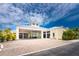 Stunning exterior of building showcasing covered entrance, beautiful landscaping and ample parking at 8407 Placida Rd # 205, Placida, FL 33946