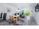 Cozy living room featuring a dining area and a sliding glass door to a serene balcony at 8407 Placida Rd # 205, Placida, FL 33946