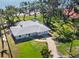 Aerial view of the home, with a well manicured yard and view of the water at 918 Edgewater Dr, Englewood, FL 34223