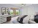 Calm and bright main bedroom with closet space and water views through sliding glass doors at 918 Edgewater Dr, Englewood, FL 34223