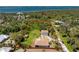 Aerial view of the property showcasing the surrounding greenery and proximity to the waterfront at 941 Allen Ave, Englewood, FL 34223