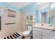Clean bathroom with walk-in shower, cream colored tile, and a modern vanity at 941 Allen Ave, Englewood, FL 34223