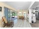 Dining area with tile flooring and access to the lanai providing a bright space for Gathering meals and entertaining guests at 941 Allen Ave, Englewood, FL 34223