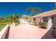 The home's patio overlooks an expansive backyard and a second building at 941 Allen Ave, Englewood, FL 34223