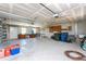 Spacious garage offering ample storage, work area, and garage door with opener at 941 Allen Ave, Englewood, FL 34223