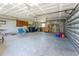 Large garage with ample space for storage and projects, equipped with a work area at 941 Allen Ave, Englewood, FL 34223