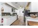 Efficient kitchen with white cabinetry, stainless steel appliances, and tile backsplash providing ample space for cooking at 941 Allen Ave, Englewood, FL 34223