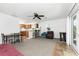 Open-concept room featuring a kitchenette, dining area, and cozy seating for versatile living at 941 Allen Ave, Englewood, FL 34223