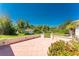 View of the patio and yard with tropical foliage offering a seamless blend of indoor-outdoor living at 941 Allen Ave, Englewood, FL 34223
