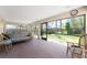Enclosed patio featuring comfortable seating with a backyard view, creating a serene outdoor space at 941 Allen Ave, Englewood, FL 34223
