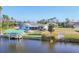Aerial view of home and boat dock at 15184 Aldama Cir, Port Charlotte, FL 33981
