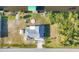 Aerial view of home with waterfront canal and dock at 15184 Aldama Cir, Port Charlotte, FL 33981