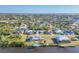 Scenic aerial view of waterfront community with single-Gathering homes and canal access at 15184 Aldama Cir, Port Charlotte, FL 33981