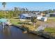 Aerial view of home with boat dock and canal at 15184 Aldama Cir, Port Charlotte, FL 33981