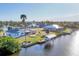Aerial view of houses on the canal at 15184 Aldama Cir, Port Charlotte, FL 33981