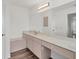 Bathroom features a large mirror and vanity with ample counter space at 15184 Aldama Cir, Port Charlotte, FL 33981