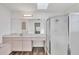 Bright bathroom featuring a vanity with ample counter space and a glass-enclosed shower at 15184 Aldama Cir, Port Charlotte, FL 33981