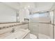 Bathroom featuring a glass enclosed shower, mosaic tile accents, and a mirrored vanity at 15184 Aldama Cir, Port Charlotte, FL 33981