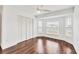 Bright bedroom featuring hardwood floors, a ceiling fan, a closet and natural light from a bay window at 15184 Aldama Cir, Port Charlotte, FL 33981