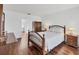 Bedroom featuring hardwood floors, a wooden bed frame, and traditional furnishings at 15184 Aldama Cir, Port Charlotte, FL 33981