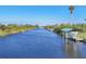 Scenic canal view of a boat dock at 15184 Aldama Cir, Port Charlotte, FL 33981