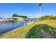 Waterfront dock with boat lift on canal at 15184 Aldama Cir, Port Charlotte, FL 33981