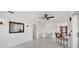 Open concept living area with tile floors, ceiling fan, and neutral decor at 15184 Aldama Cir, Port Charlotte, FL 33981