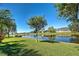 Water view featuring a pond, green grass, and landscaping at 1078 Boundary Blvd, Rotonda West, FL 33947