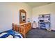 Bedroom with blue carpet and furniture with wooden accents at 1078 Boundary Blvd, Rotonda West, FL 33947