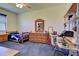 Bedroom with blue carpet, wooden furniture and desk workspace at 1078 Boundary Blvd, Rotonda West, FL 33947