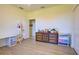 Clean bedroom with wood flooring, dresser and a large storage bin at 1078 Boundary Blvd, Rotonda West, FL 33947