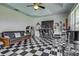 A vibrant entertainment room with a bar, jukebox, and checkered floors at 1078 Boundary Blvd, Rotonda West, FL 33947