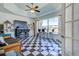Entertainment room with a bar, stools, and checkered floors at 1078 Boundary Blvd, Rotonda West, FL 33947