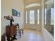 Entryway featuring tile floors, decorative front door, and a small table at 1078 Boundary Blvd, Rotonda West, FL 33947