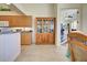 Kitchen featuring tile flooring, wooden cabinetry, and decorative dishware at 1078 Boundary Blvd, Rotonda West, FL 33947