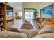 Inviting living room featuring comfortable seating and a sliding door that offers plenty of light at 1078 Boundary Blvd, Rotonda West, FL 33947