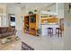 Open-concept living space with tiled floors and views of the kitchen and dining area at 1078 Boundary Blvd, Rotonda West, FL 33947
