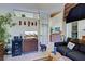 Living room area with a sofa, TV, and french doors at 1078 Boundary Blvd, Rotonda West, FL 33947