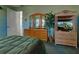 Main bedroom with woven furniture, entertainment center, and art at 1078 Boundary Blvd, Rotonda West, FL 33947