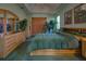 Main bedroom with lots of woven furniture and potted plants at 1078 Boundary Blvd, Rotonda West, FL 33947