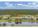 Community homes with water view featuring lush landscaping, community lakes, and tranquil waterfront access at 1080 Boundary Blvd, Rotonda West, FL 33947