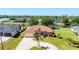 Waterfront home with well-maintained lawn and large circular driveway at 1080 Boundary Blvd, Rotonda West, FL 33947