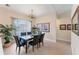 Dining room with a decorative chandelier and views of the outdoors at 1080 Boundary Blvd, Rotonda West, FL 33947