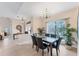 Dining room featuring tile floors, a chandelier, and plenty of natural light at 1080 Boundary Blvd, Rotonda West, FL 33947