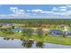 Community homes with lake view featuring lush landscaping and beautiful waterfront access at 1080 Boundary Blvd, Rotonda West, FL 33947