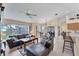 Open-concept living area with comfortable leather furniture, dining area, and views of the lake at 1080 Boundary Blvd, Rotonda West, FL 33947