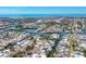 Panoramic aerial view of coastal neighborhood with canals and the ocean in the distance at 1141 Andrews St, Englewood, FL 34224